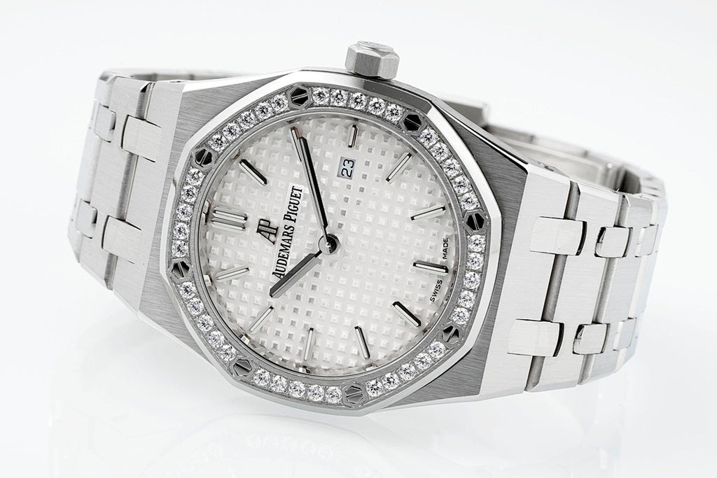 Audemars Piguet wristwatch with diamond bezel, white textured dial, metal bracelet links