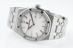 Audemars Piguet wristwatch with diamond bezel, white textured dial, metal bracelet links