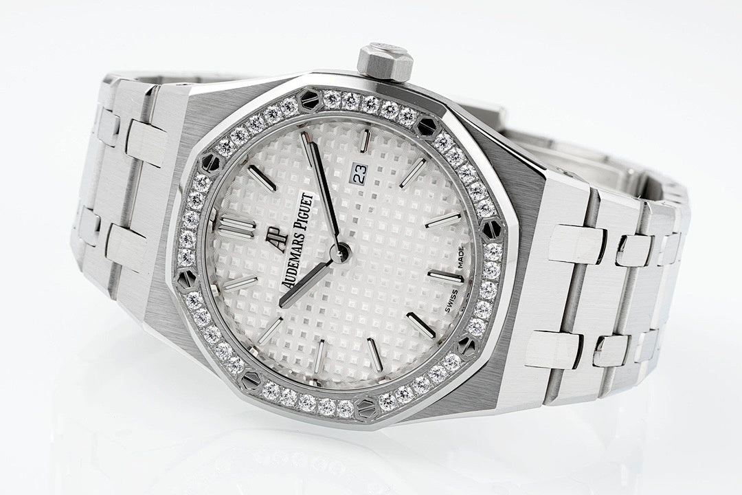 Audemars Piguet wristwatch with diamond bezel, white textured dial, metal bracelet links