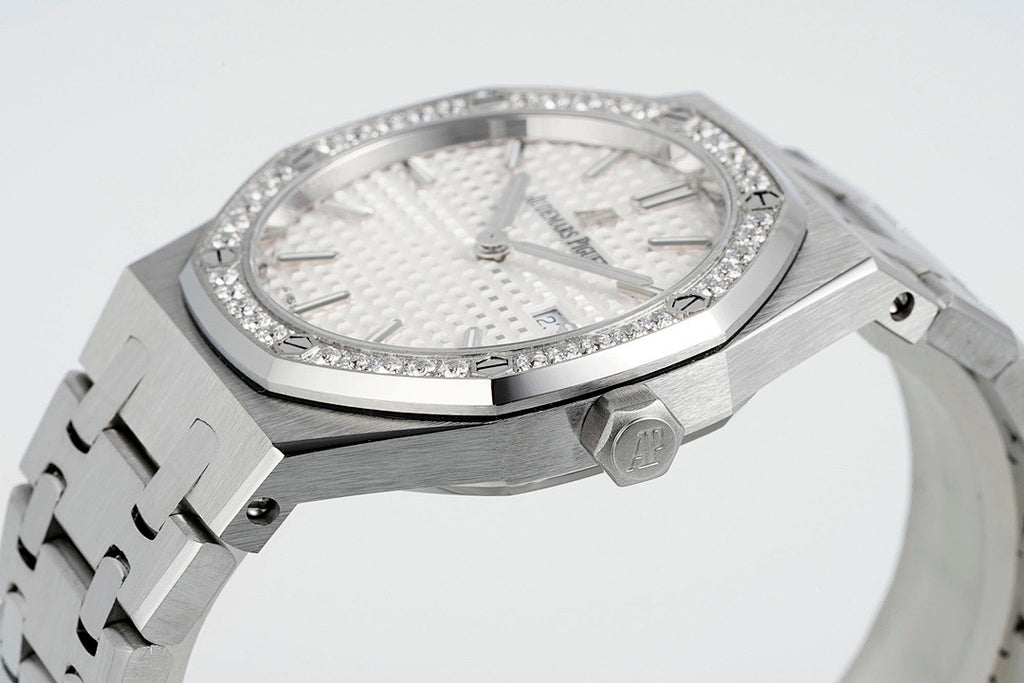 Audemars Piguet wristwatch side profile with diamond bezel and crown at 3 o’clock