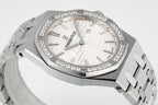 Audemars Piguet wristwatch with diamond bezel, white dial, and silver metal bracelet