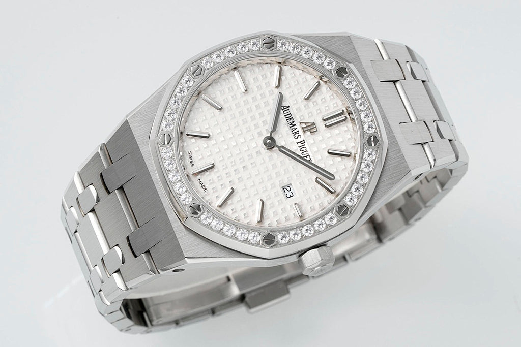 Audemars Piguet wristwatch with diamond bezel, white dial, and polished steel bracelet