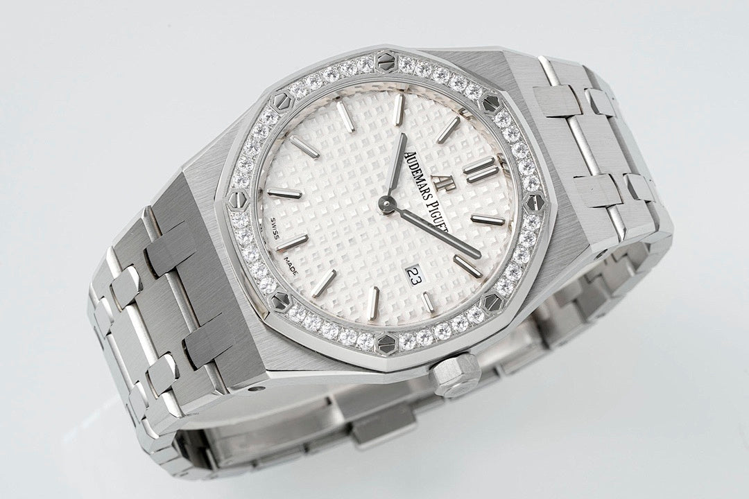 Audemars Piguet wristwatch with diamond bezel, white dial, and polished steel bracelet