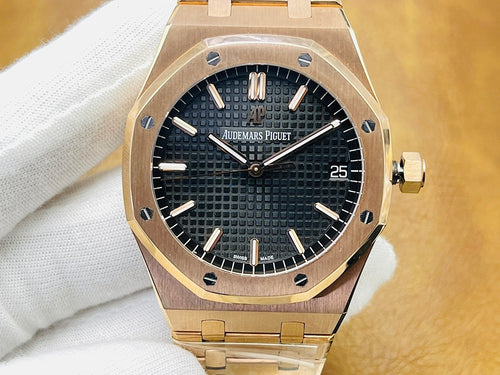 Audemars Piguet watch with black textured dial, gold-tone bezel and bracelet, date at 25.