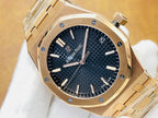 Audemars Piguet watch with black textured dial, gold-tone octagonal case, and markers.