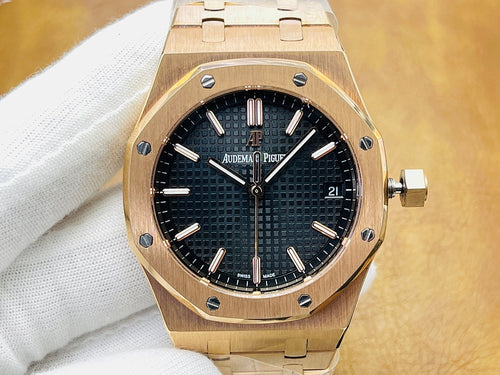 Gold-tone luxury watch with black textured dial, baton markers, and date window