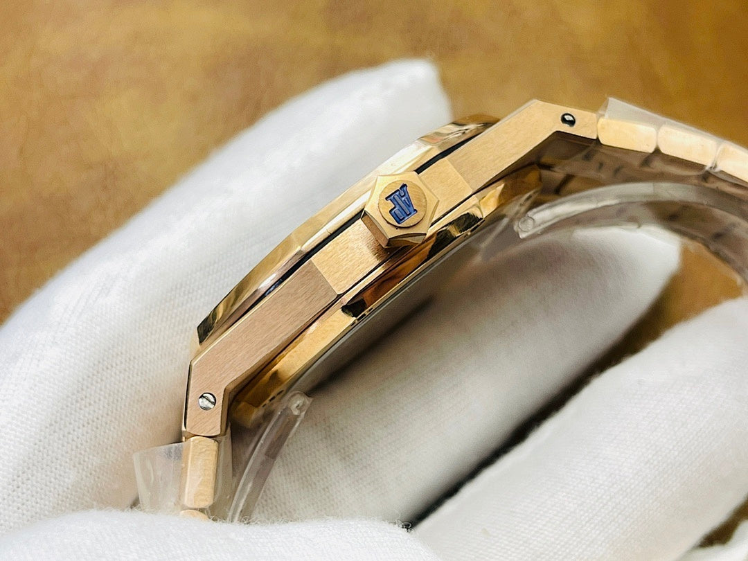 Gold-tone wristwatch clasp and case side detail on white cloth