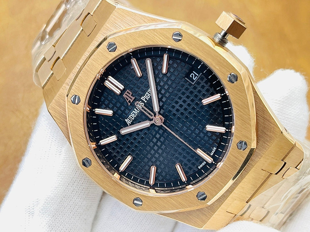 Gold-tone luxury watch with dark blue textured dial, baton markers, and crown