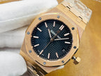 Gold-tone luxury watch with dark blue textured dial and baton hour markers