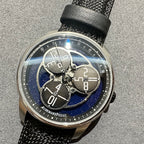 Audemars Piguet watch with blue patterned skeleton dial, black textured strap
