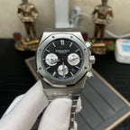 Audemars Piguet chronograph watch with black dial, white subdials, and steel bracelet, front