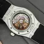 Audemars Piguet Royal Oak watch case back with exposed movement and white strap