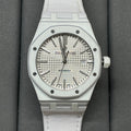 Audemars Piguet Royal Oak watch with silver dial and white rubber strap