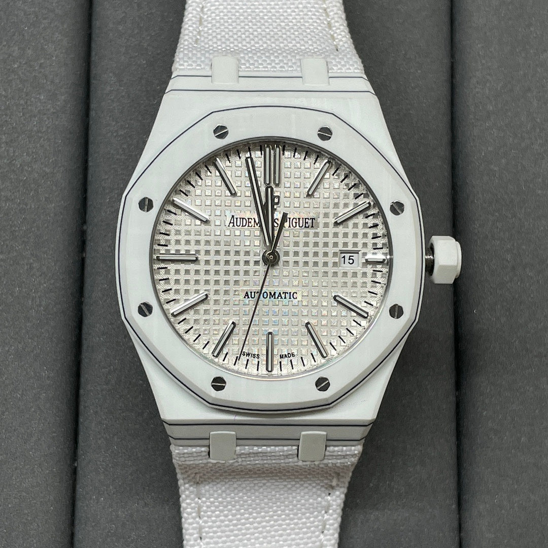 Audemars Piguet Royal Oak watch with silver dial and white rubber strap