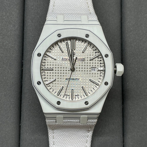 Audemars Piguet Royal Oak watch with silver dial and white rubber strap