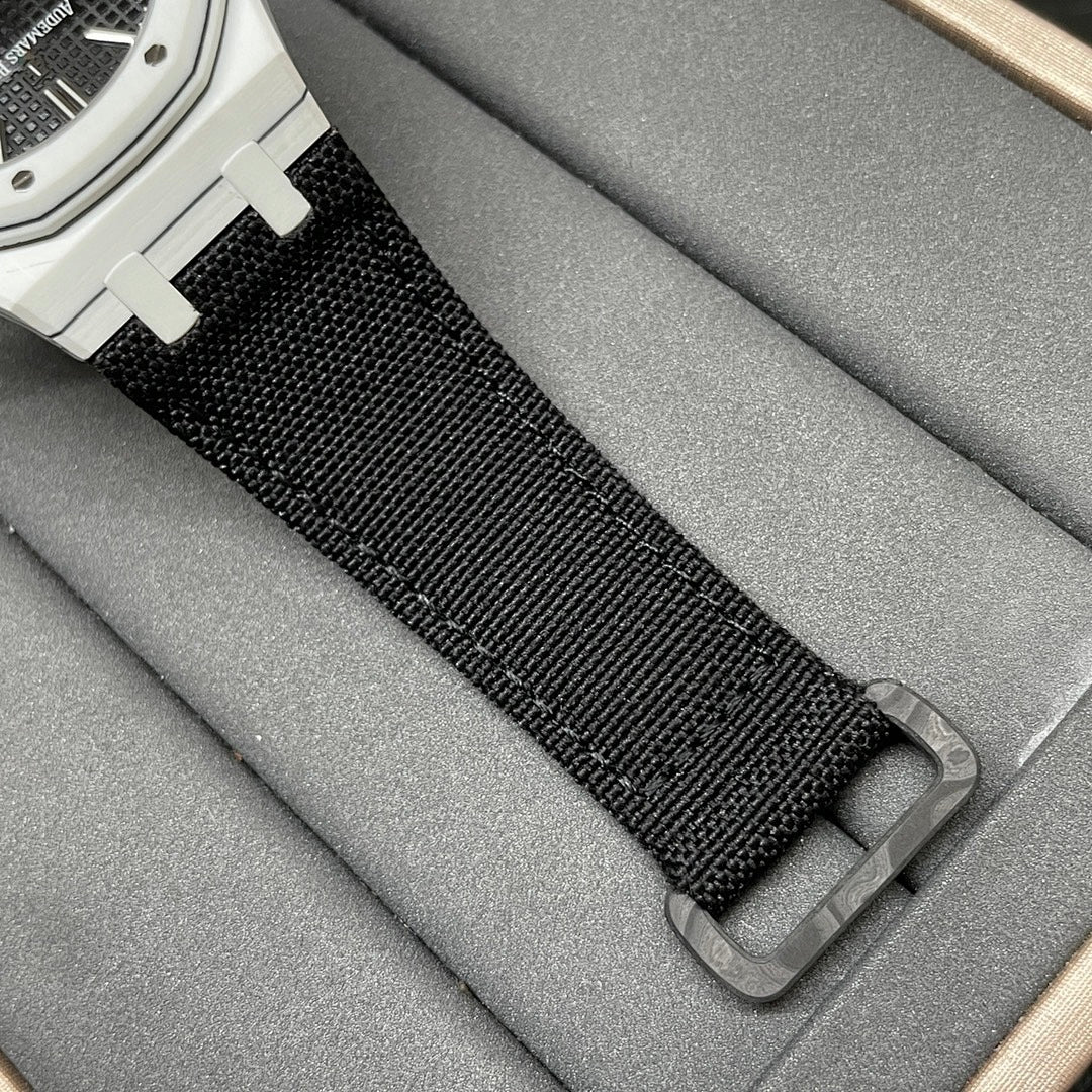 Audemars Piguet wristwatch strap close-up with black woven fabric and metal buckle