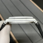 Audemars Piguet wristwatch crown-side view with brushed steel case and black strap