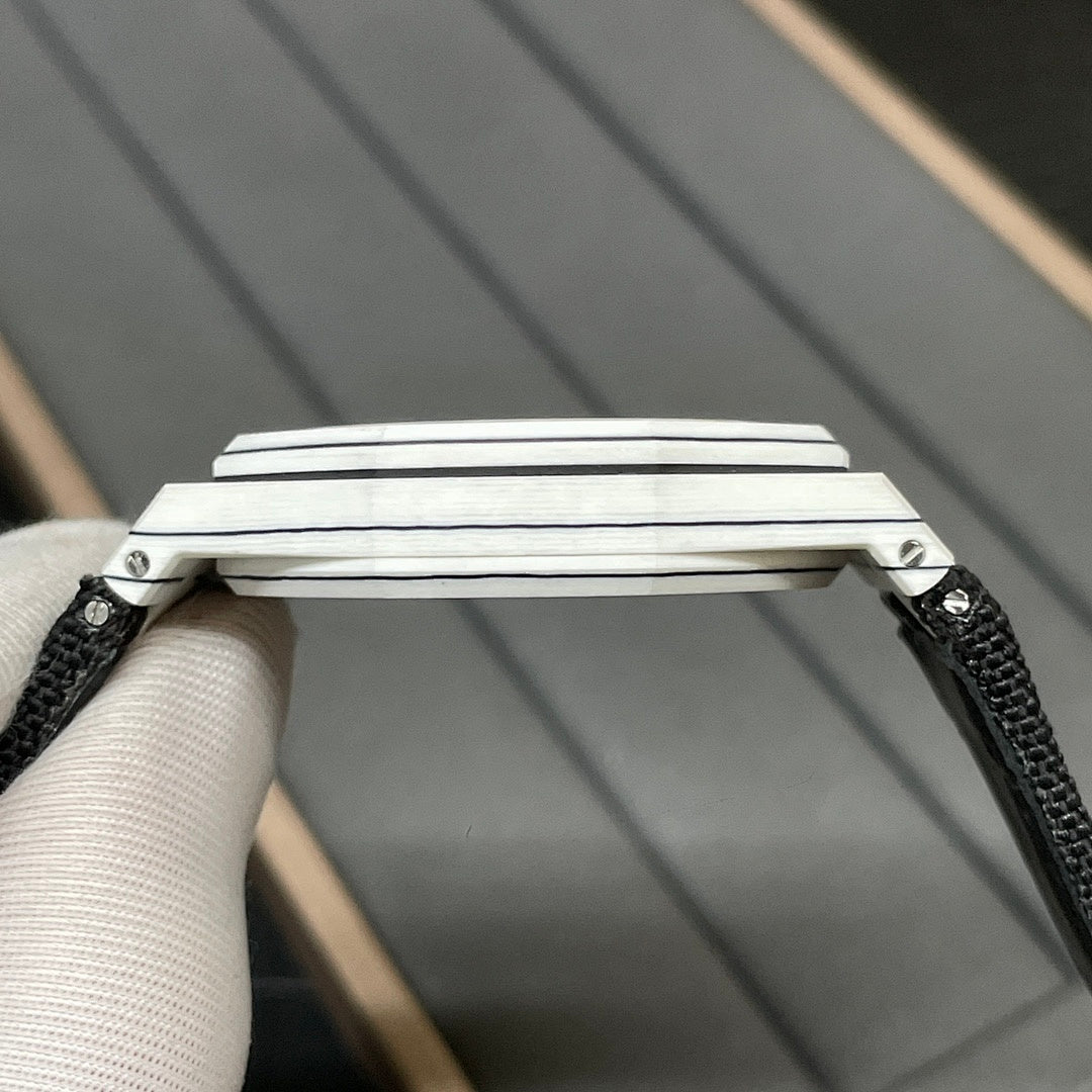 Audemars Piguet wristwatch crown-side view with brushed steel case and black strap