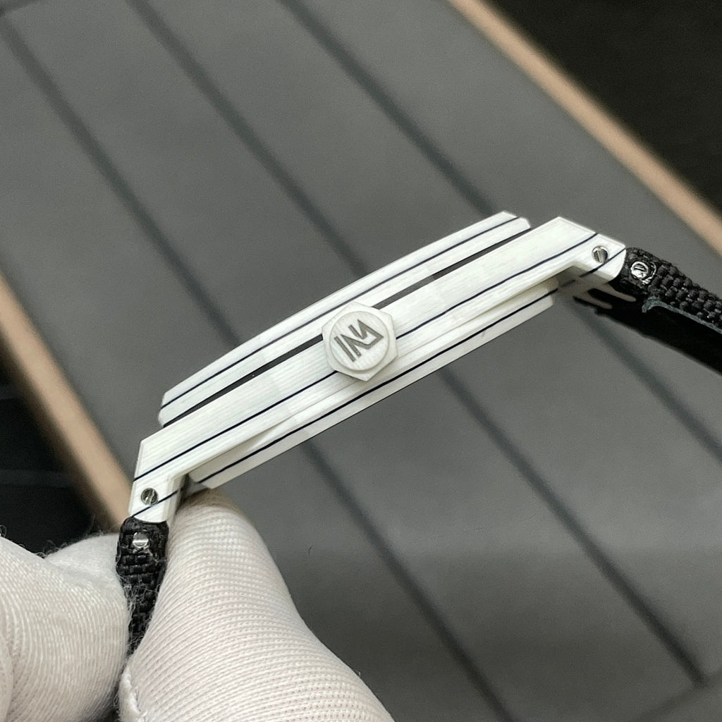 Audemars Piguet wristwatch clasp and lug detail on black woven strap