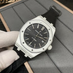 Audemars Piguet wristwatch with black dial, steel case, and black fabric strap