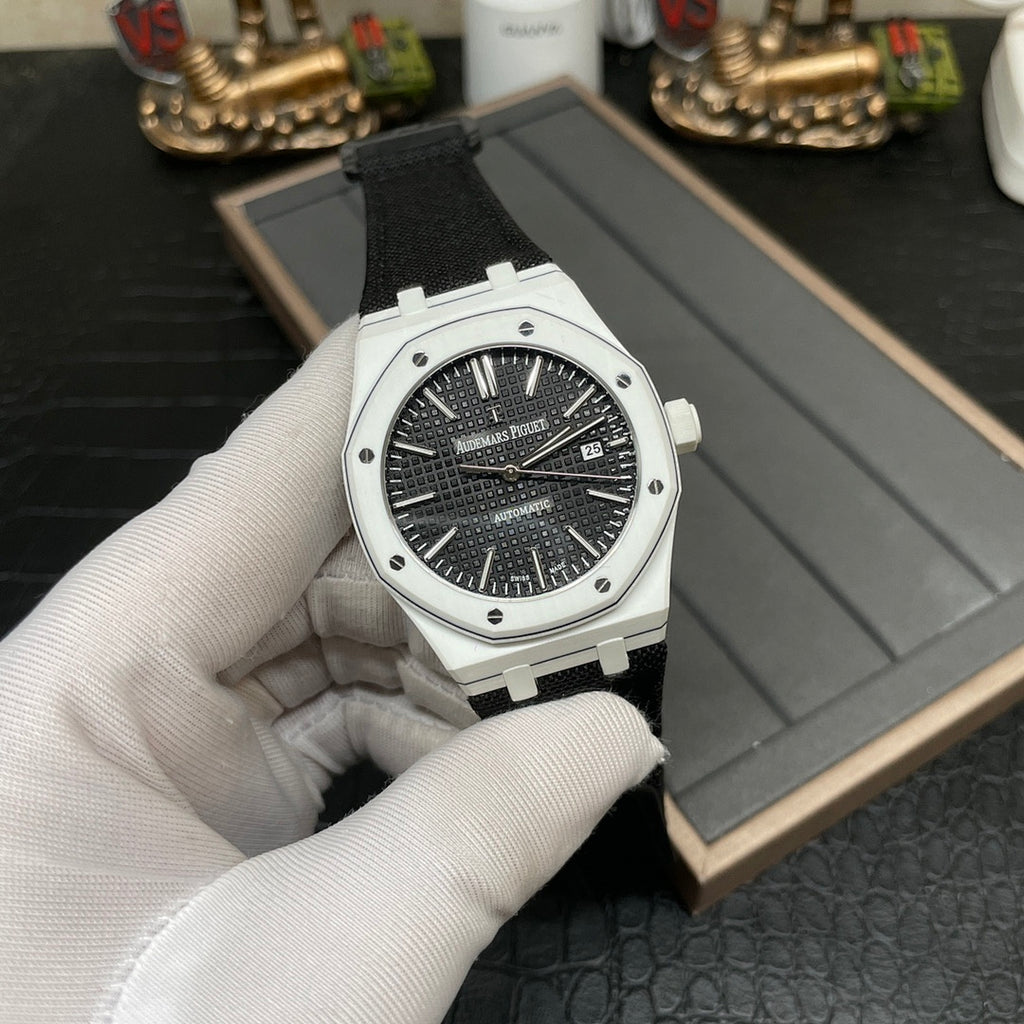 Audemars Piguet wristwatch on strap with black dial and date window at 3 o'clock