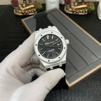 Audemars Piguet wristwatch on strap with black dial and date window at 3 o'clock