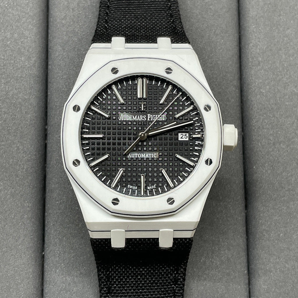 Audemars Piguet wristwatch with black textured dial, steel bezel, black fabric strap