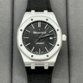 Audemars Piguet wristwatch with black textured dial, steel bezel, black fabric strap
