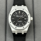 Audemars Piguet wristwatch with black textured dial, steel bezel, black fabric strap