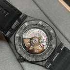 Audemars Piguet watch caseback with visible movement and black leather strap