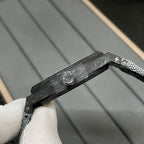 Audemars Piguet watch case edge close-up with black textured strap and clasp