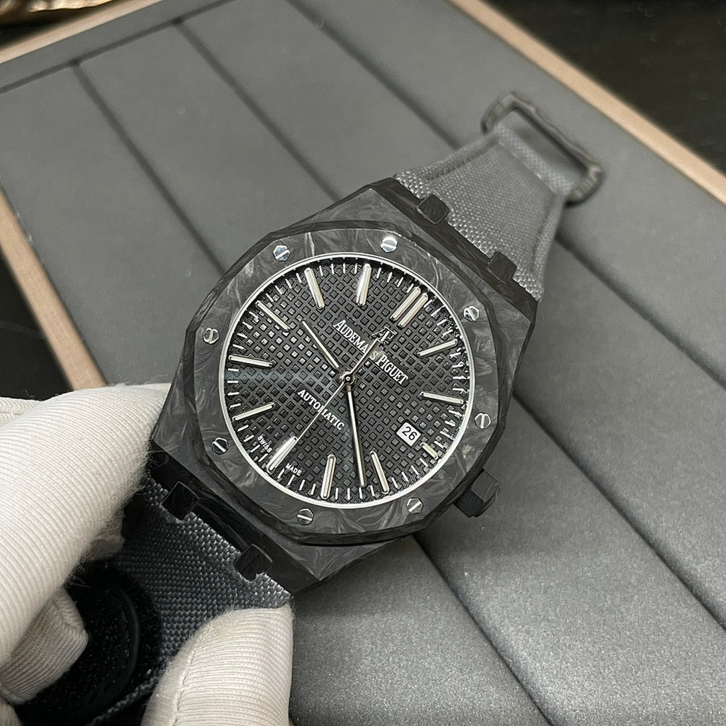 Audemars Piguet watch with black patterned dial, date window, black strap