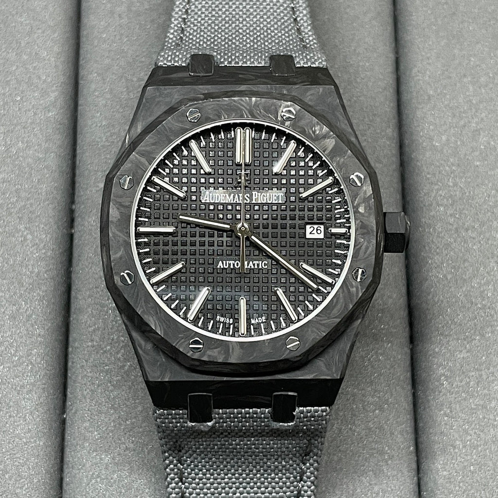 Audemars Piguet watch with black textured dial, date window at 3, black mesh strap