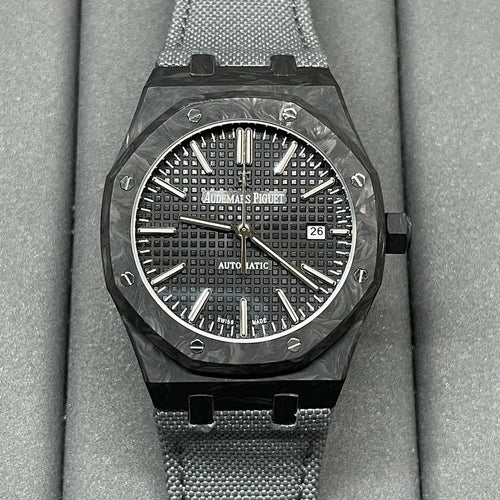 Audemars Piguet watch with black textured dial, date window at 3, black mesh strap