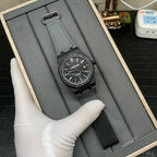 Audemars Piguet watch in presentation box, black dial and dark fabric strap