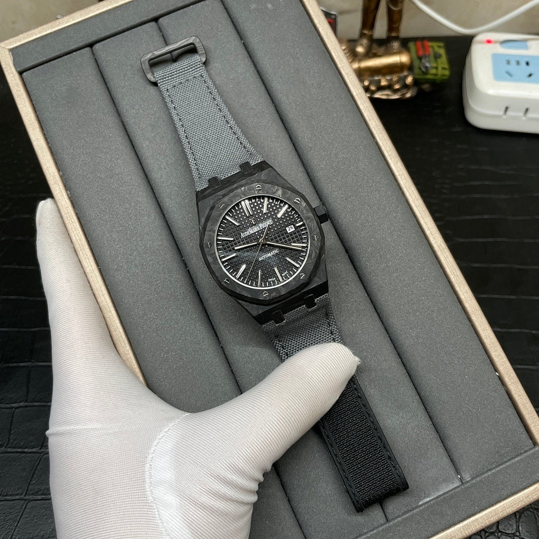 Audemars Piguet watch in presentation box, black dial and dark fabric strap