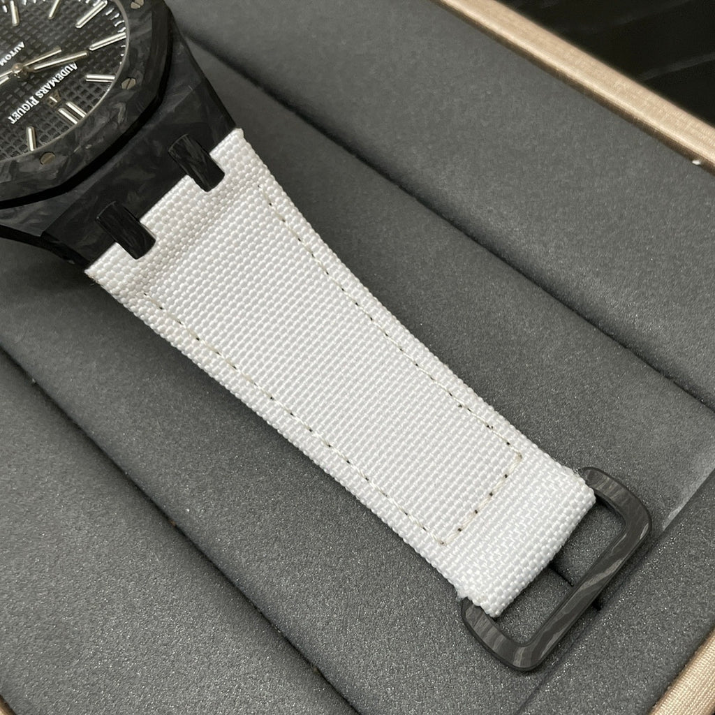 White textured watch strap with black deployant buckle