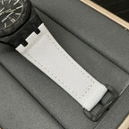 White textured watch strap with black deployant buckle