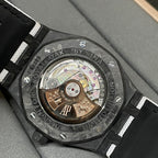 Audemars Piguet caseback watch with visible movement and engraved rotor