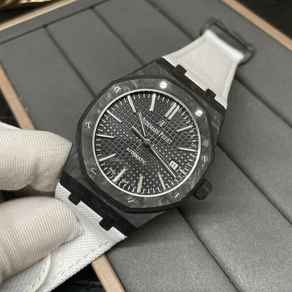 Audemars Piguet automatic watch with black textured dial and white strap, close-up