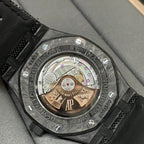 Audemars Piguet watch with transparent caseback showing gold-toned movement