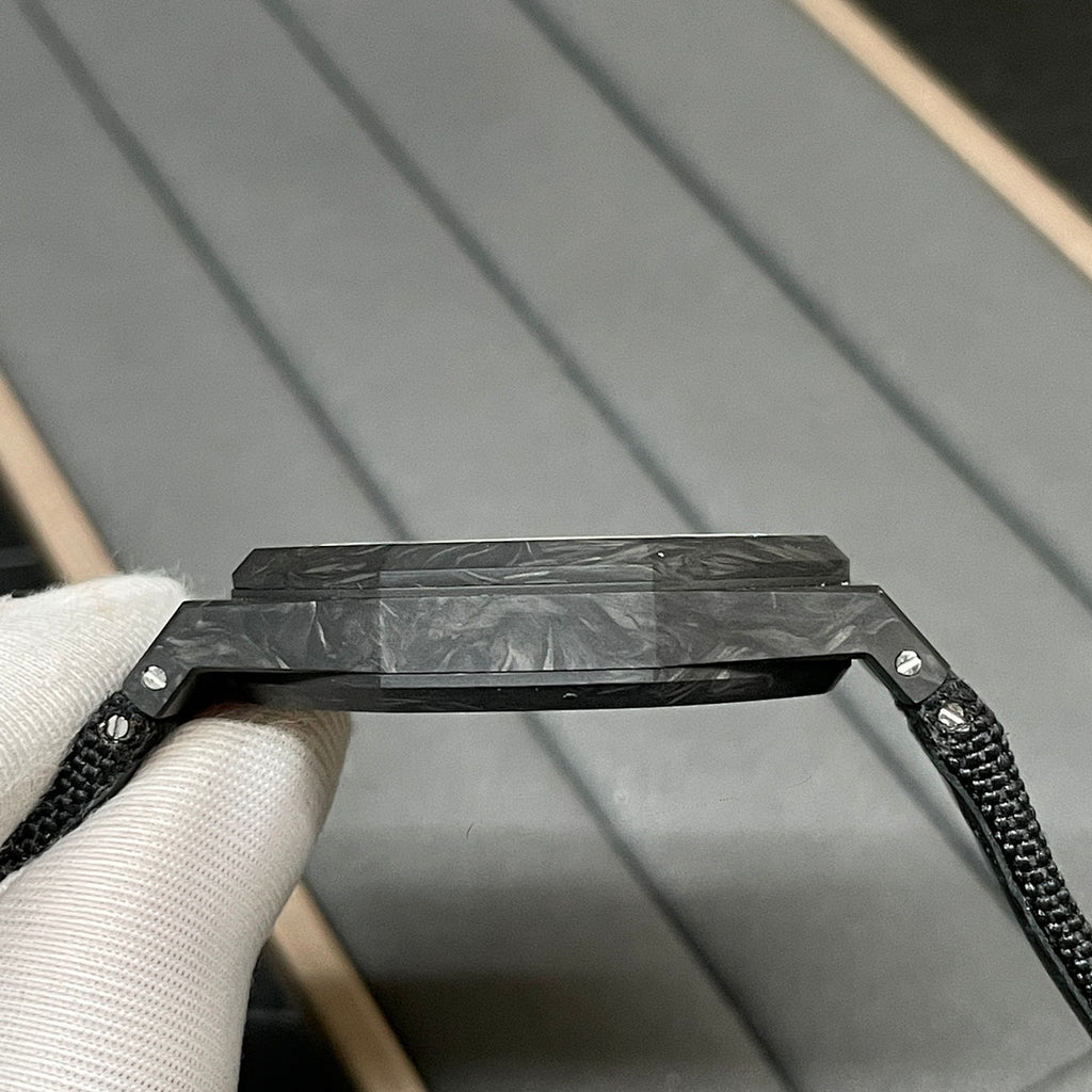 Audemars Piguet black watch case with textured strap and metal bezel