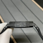 Audemars Piguet black watch case with textured strap and metal bezel