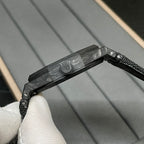 Audemars Piguet black watch side view with crown and textured strap