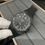 Audemars Piguet black dial sports watch with markers and date window