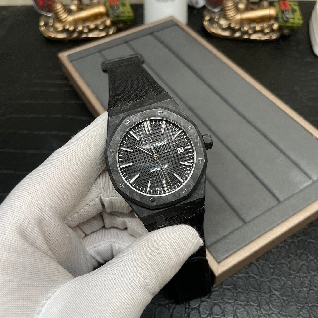 Audemars Piguet black sports watch angled view with textured dial and date window