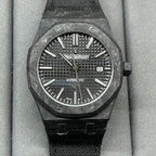 Audemars Piguet black sports watch with textured dial and date window