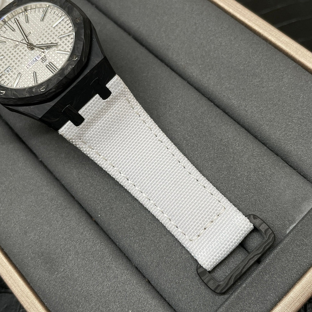 Audemars Piguet Royal Oak watch on a white fabric strap with black deployant clasp