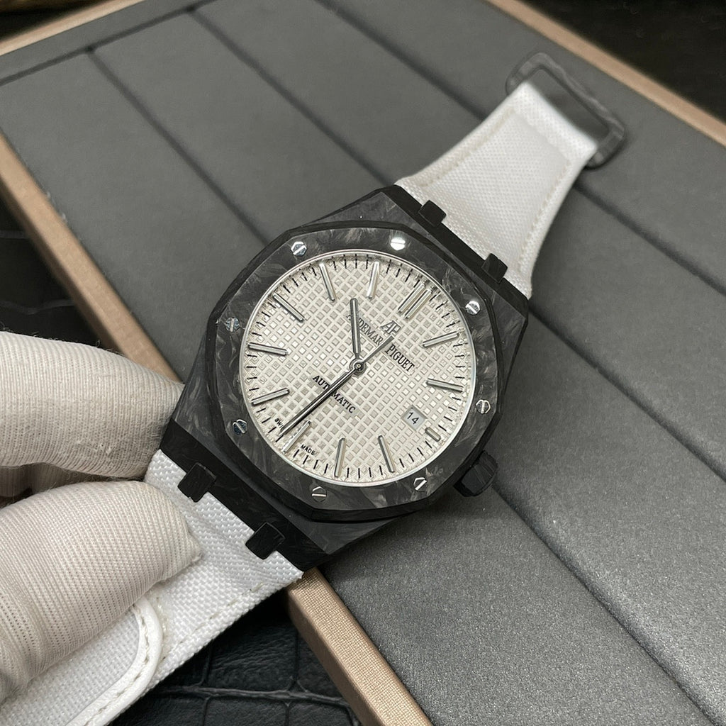 Audemars Piguet Royal Oak watch with white dial, black case, and white fabric strap
