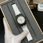Audemars Piguet Royal Oak watch with black case, white strap, and silver-toned dial